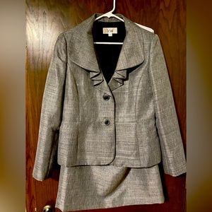 Le Suit two piece black and white suit with skirt.